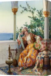 Amedeo Canvas Paintings - A Turkish Beauty Resting on a Terrace by Amedeo Momo Simonetti